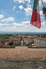 Italy - Caprarola - Town View - Aerial view over the rooftops of Caprarola with an Italian flag
