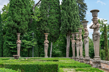 Italy - Caprarola - Palazzo Farnese - Stone statues and herms with urns in the formal Renaissance gardens