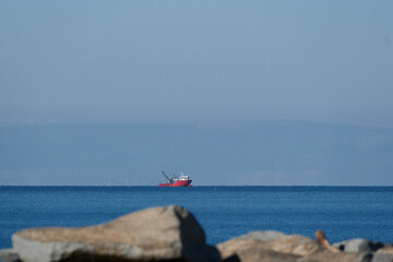 Obraz premium Rocky Black Sea Shore Under Clear Blue Sky. Serene Rocky Coast of the Black Sea on a Sunny Day