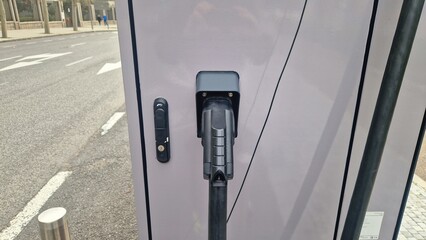 Electric vehicle charging point on city street