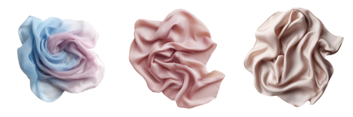 Three draped silk fabrics in soft pastel colors with flowing folds isolated on a transparent background
