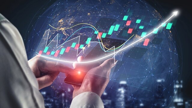 A person analyzes market trends using a smartphone displaying financial graphs and data overlays, symbolizing digital finance and economic growth in a modern urban setting. Copula - Powered by Adobe
