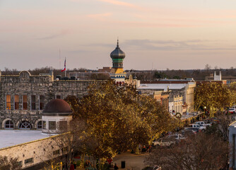 Fototapeta premium Christmas lights surround the Williamson County Old Masonic Lodge in downtown Georgetown in Texas in late December 2025