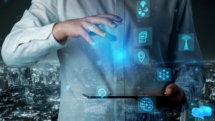 A man in a white shirt engages with a holographic digital interface showcasing various icons, symbolizing technology role in modern communication and innovation. Xenic