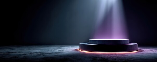 A purple spotlight illuminates a multi-tier pedestal on a dark stage with a glowing ring