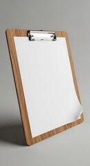 A wooden clipboard angled slightly, holding a blank white paper with one corner curled up. A silver clip secures the paper, with a neutral gray background