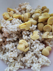Boiled pearl barley mixed with mushrooms