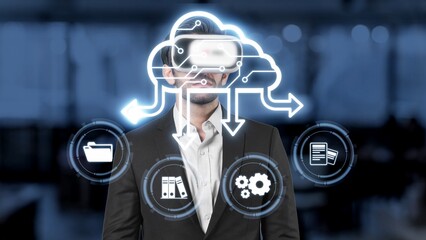 A businessman utilizes a virtual reality headset to engage with cloud computing icons, symbolizing the digital transformation within a corporate workspace. Raster