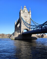 Obraz premium View of Tower Bridge over the river Thames against clear blue sky in London, England, UK.