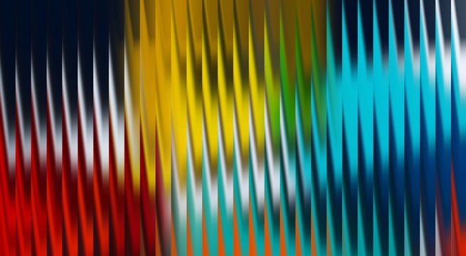 A vibrant and dynamic display of color. The image showcases vertical lines in a spectrum of hues, from red to blue, with each color flowing into the next