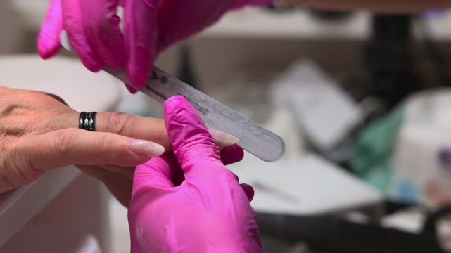 Manicure Process With Careful Filing, Professional Nail Maintenance Using Soft Motion And Clean Workspace. Media