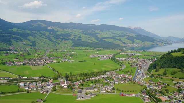 Aerial view around the city Giswil beside the the lake Sarnen in Switzerland on a sunny day in summer. 
