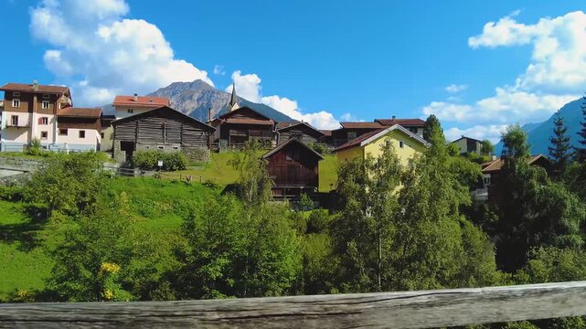 Driving around the swiss alps in the village schmitten on a sunny day in summer