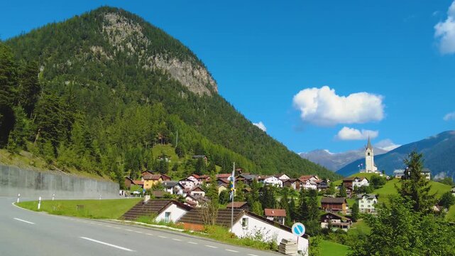 Street view around the village Schmitten in Switzerland on a sunny day in summer.