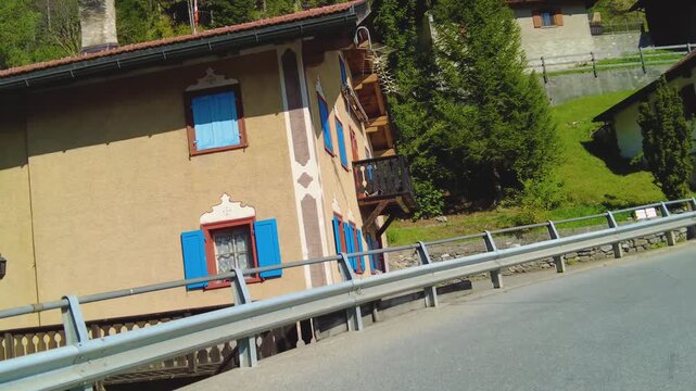 Driving around the swiss alps in the village schmitten on a sunny day in summer