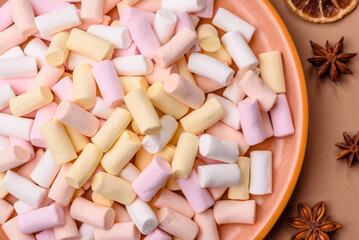 Mini marshmallows in white, pink, and pastel colors. Marshmallows as a food background