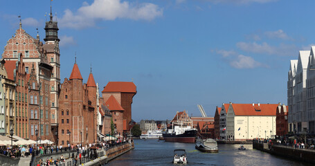 Tourists flocking to the old town harbor in Gdansk Poland