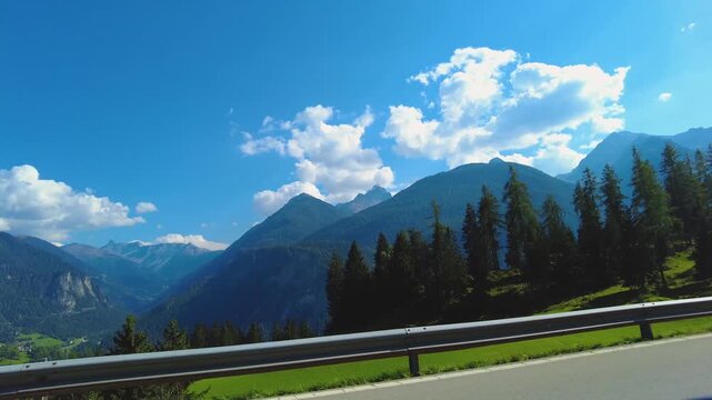 Driving around the swiss alps in the village schmitten on a sunny day in summer