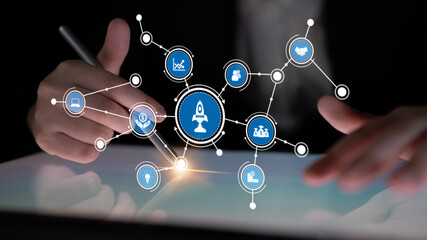 A business professional engages with a digital interface featuring various icons, representing innovation, growth strategies, and modern technology trends. Tessel
