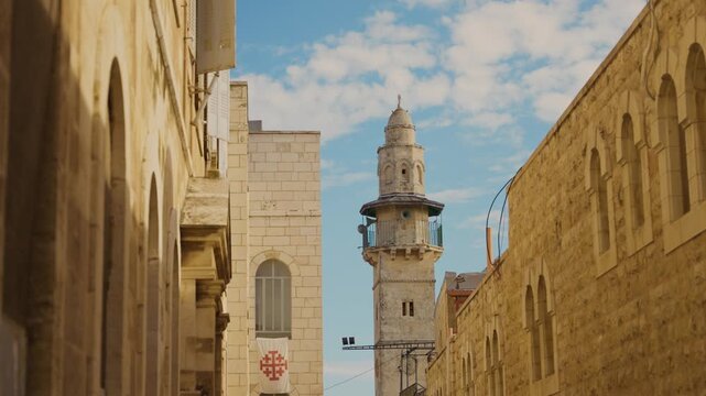 View of famous mosque of Minaret of Saladin Khanqah in old city of Jerusalem. Tall tower of muslim religion in the ancient old citadel town in Israel Holy Land. Muezzin summon call from the Minaret