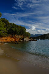 Quiet tranquil beach in Fethiye, Turkey on sunny day
