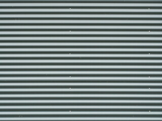 Obraz premium Vertical gray corrugated metal panels with rivets. Matte light and shadow play. Industrial aesthetic. Copyspace.