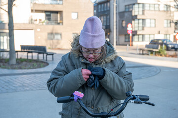 Outdoor portrait of a 43-year-old woman with Down Syndrome, cozy winter setting