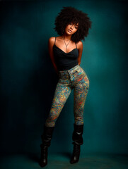 Professional studio photograph of a girl with afro hair looking at the camera.