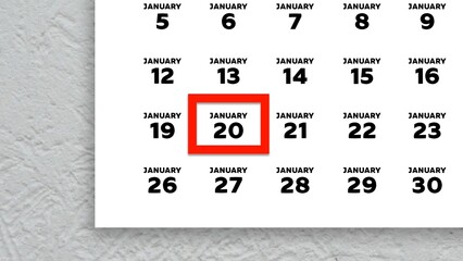 Close-up of the date January 20th marked with a red cursor on the wall calendar 2026