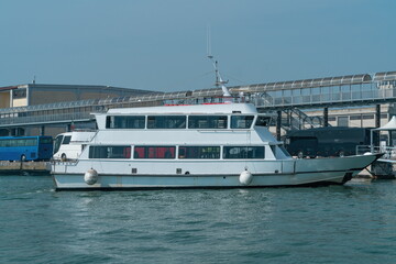White passenger ferry moored at port terminal Venice, Italy