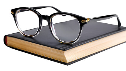 Modern Black Eyeglasses Resting on a Closed Leather Book

