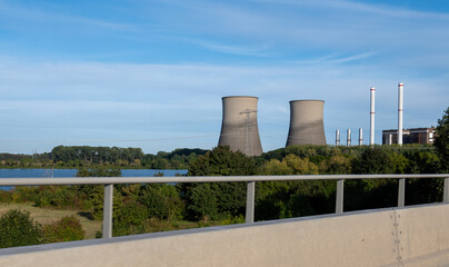 Fototapeta premium Power plant, view on cooling towers located on Maas river, Limburg, The Netherlands, Dutch industry