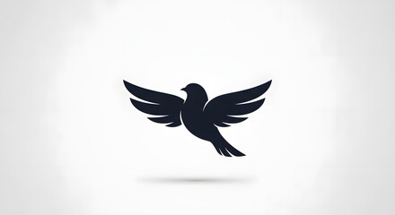 Obraz premium Stylized dark silhouette of a peaceful dove bird in full flight showcasing widespread wings against a clean light gray background perfect for logo design concepts.