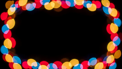 Vibrant multicolored lights forming a circular border on black background