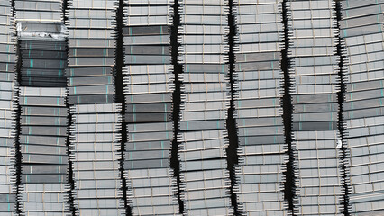 Many stacks of Industrial PVC pipes for underground pipe lines at construction site.