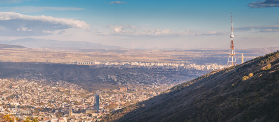 Panoramic view of Tbilisi, Georgia, with the TV Tower prominently featuring on the side of Mount Mtatsminda