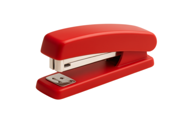 Red office stapler isolated on black background representing business desktop supply tool concept symbolizing productivity corporate organization and office equipment accessory 