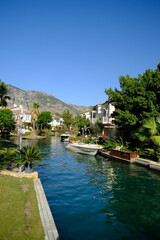 Fototapeta premium Scenic view of Göcek, a picturesque coastal town on the Turkish Riviera which known for its modern marinas, luxury yachts, and surrounding islands and bays in Fethiye, Turkey.