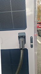 Ev charging station unhooked cable in urban environment