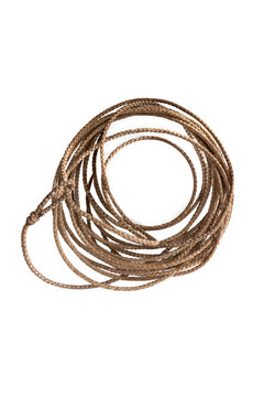 Rope framing makes a circle. Round frame made of cowhide is isolated. Circular rope frame is old leather lariat long enough to  make several loops.