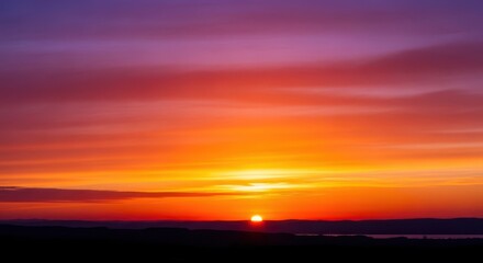 Fototapeta premium Evocative evening landscape capturing the tranquil beauty of nature during golden hour, featuring a serene sunset sky and dark horizon silhouette, tranquil, afterglow, landscape