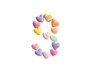 Number nine formed with colorful heart-shaped candies