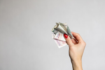 money in woman hand on the white background
