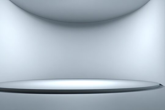 Empty stage with curved backdrop, illuminated by two spotlights