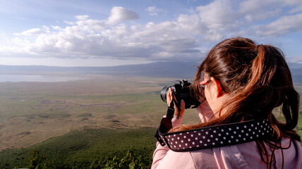 Photographer capturing the vast Ngorongoro Crater scenery