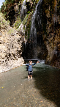 Man enjoying Engare Sero Waterfall in Tanzania