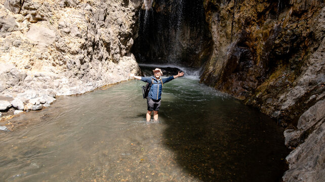 Man enjoying Engare Sero Waterfall in Tanzania