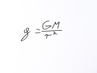 Minimal handwritten gravitational formula “g   GM / r²” on a white background. Concept representing gravitational field strength near massive bodies. © Michal