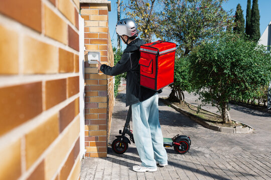 Young delivery boy on an electric scooter