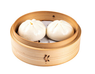 Two steamed buns sit in a bamboo steamer